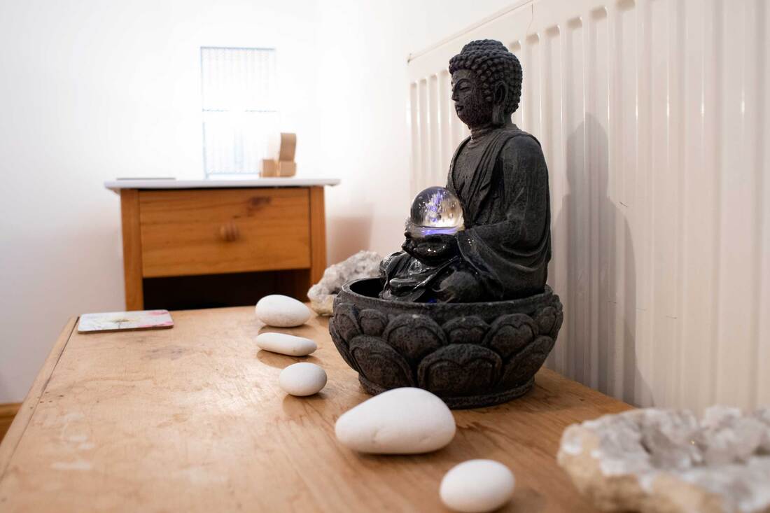 Picture of Counselling Room close up of relaxing sound buddha and stones